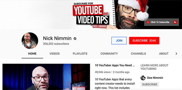 Questo è uno screenshot del canale YouTube di Nick Nimmin. In alto, la foto di copertina mostra Nick con un cappello da Babbo Natale. Sta sbirciando da dietro l