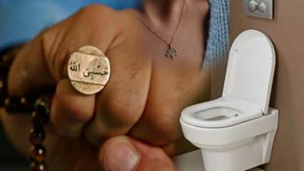 È possibile entrare in bagno con un amuleto e una collana chiamata Allah? Entrando nella toilette con un versetto e un'iscrizione di preghiera.