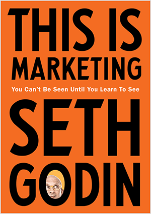 Questo è uno screenshot della copertina di This Is Marketing di Seth Godin. La copertina è un rettangolo verticale con uno sfondo arancione e testo nero. Una foto della testa di Seth appare nella O del suo cognome.